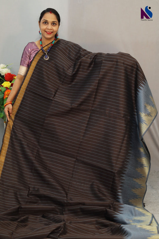 Timeless coffee shade paired with delicate craftsmanship in handloom saree