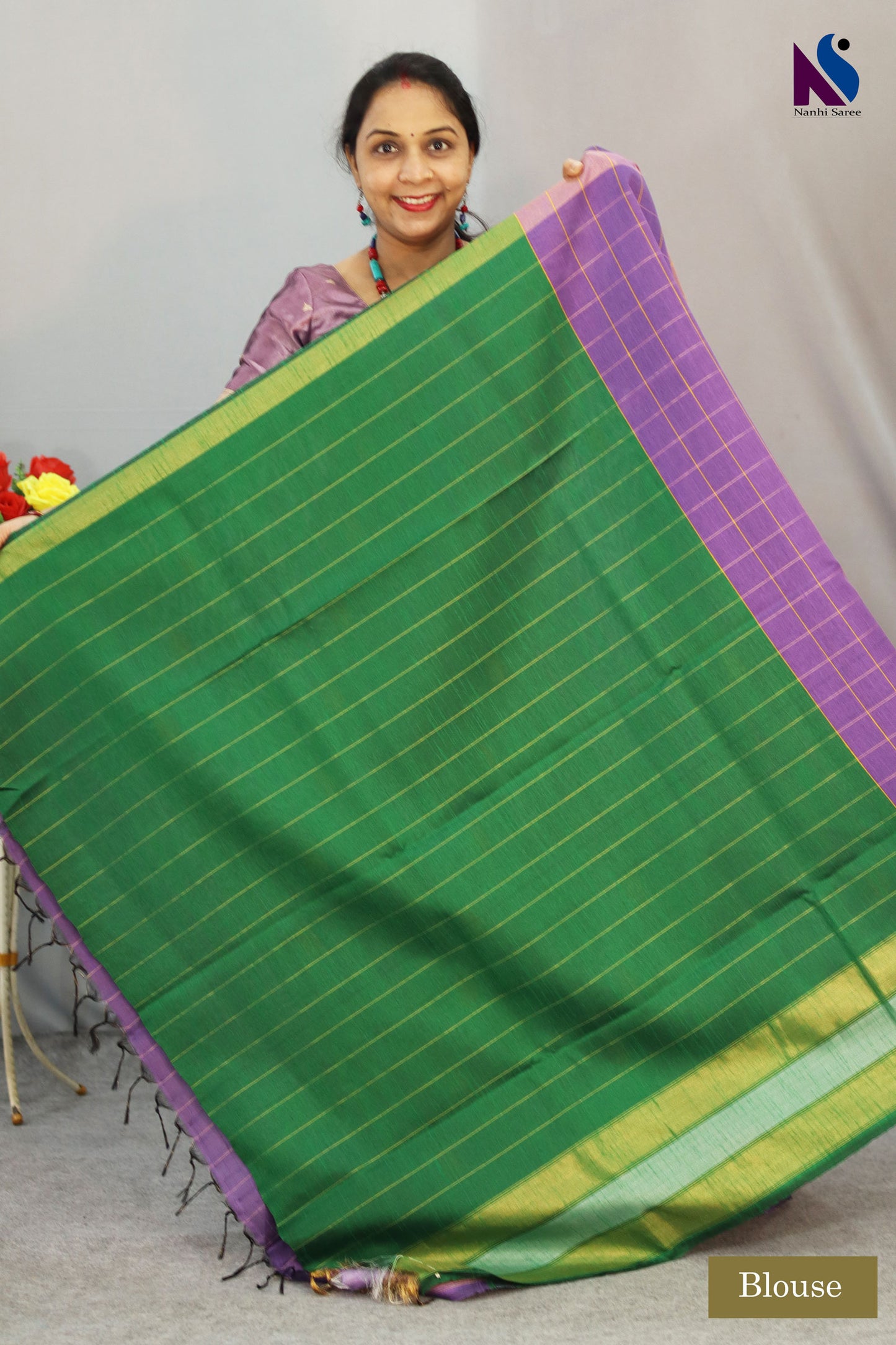 Handcrafted premium art tussar saree featuring purple body, green pallu and beautiful buta motifs