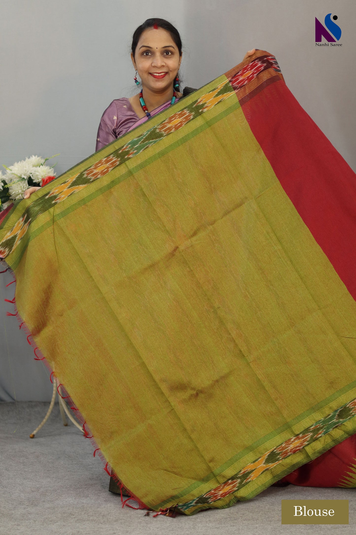 Traditional geometric patterns shine in this red Pochampally design handloom saree