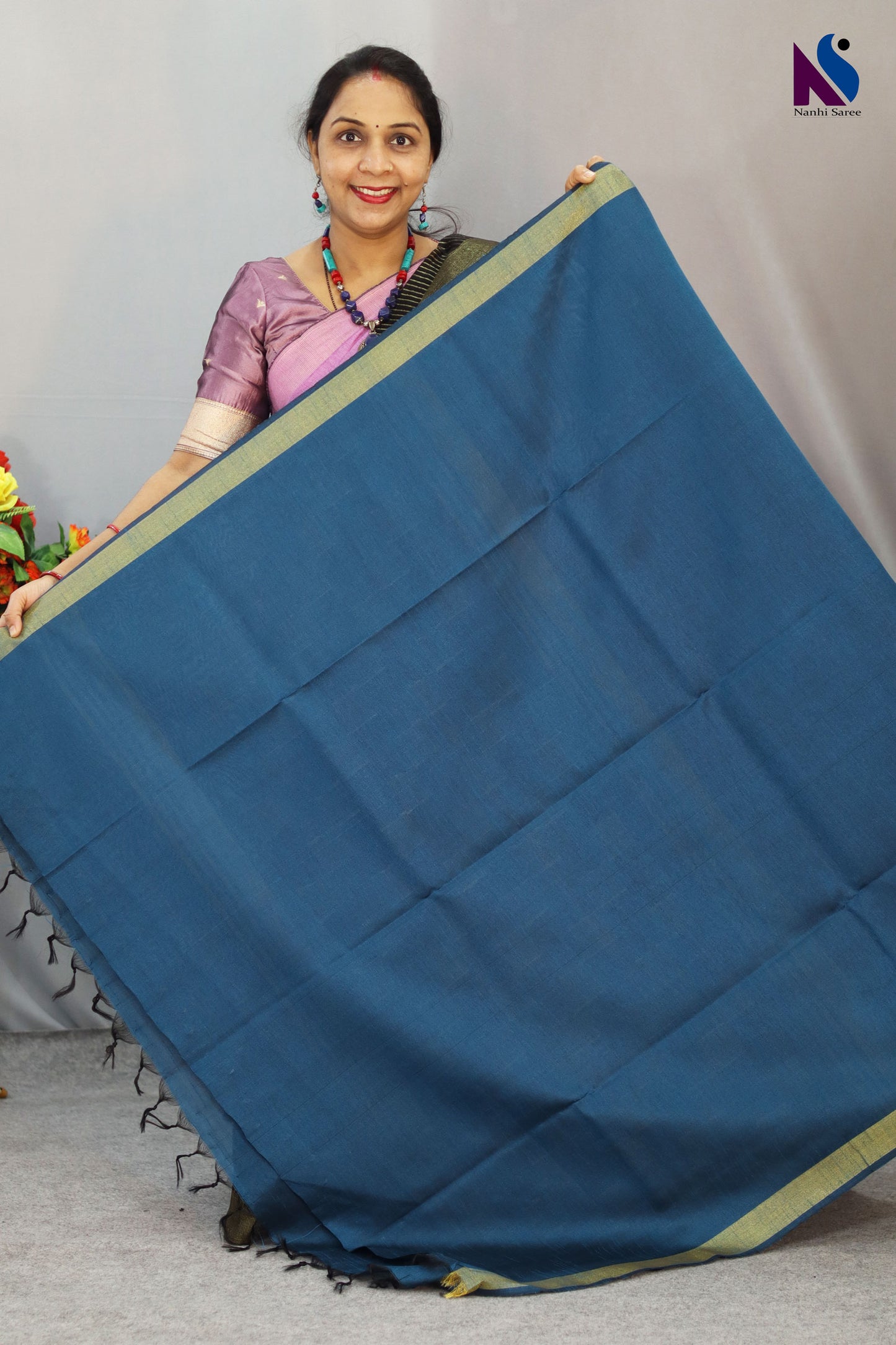 Beautiful detailing enhances the charm of this light blue handloom saree