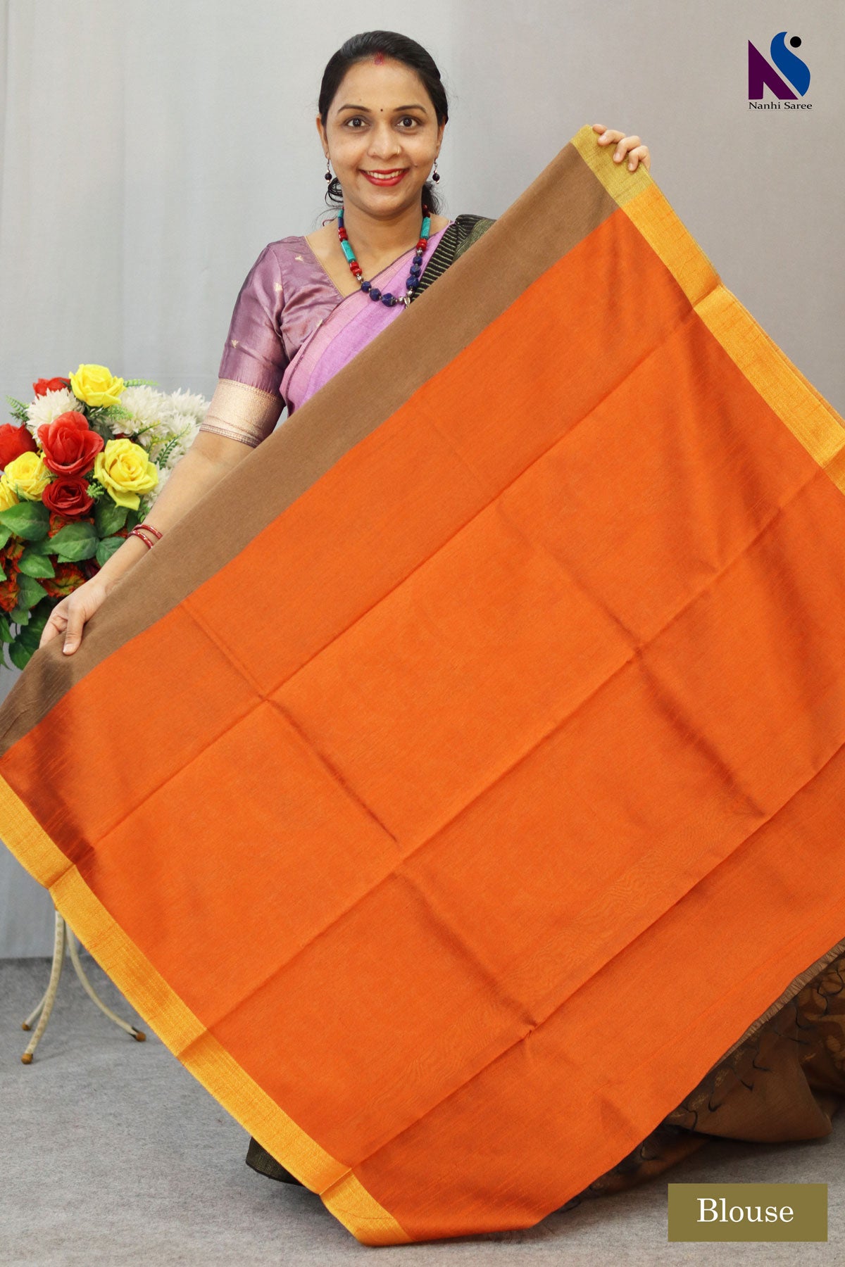 Subtle light brown tone enhanced with intricate handwoven detailing saree