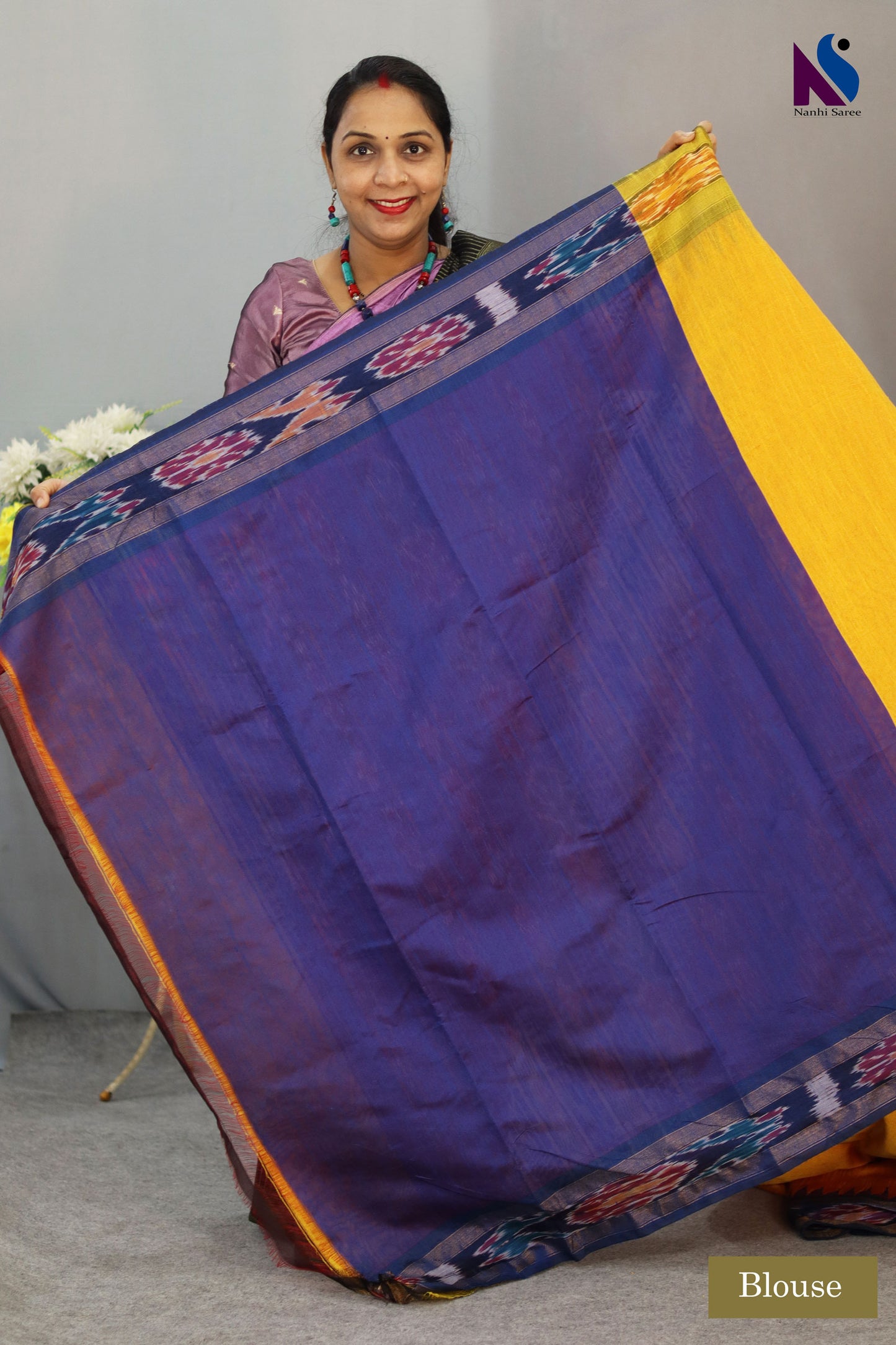 Rich yellow handloom saree highlighted with traditional Pochampally design