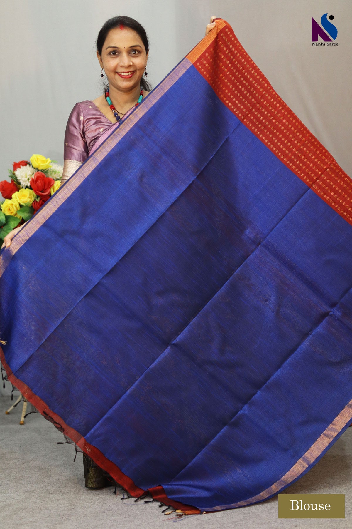 A luxurious wine red and blue pallu handloom creation with classic woven charm