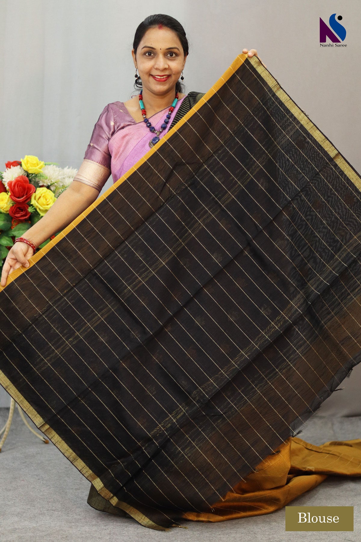 Royal fusion of golden and black crafted in premium handloom saree