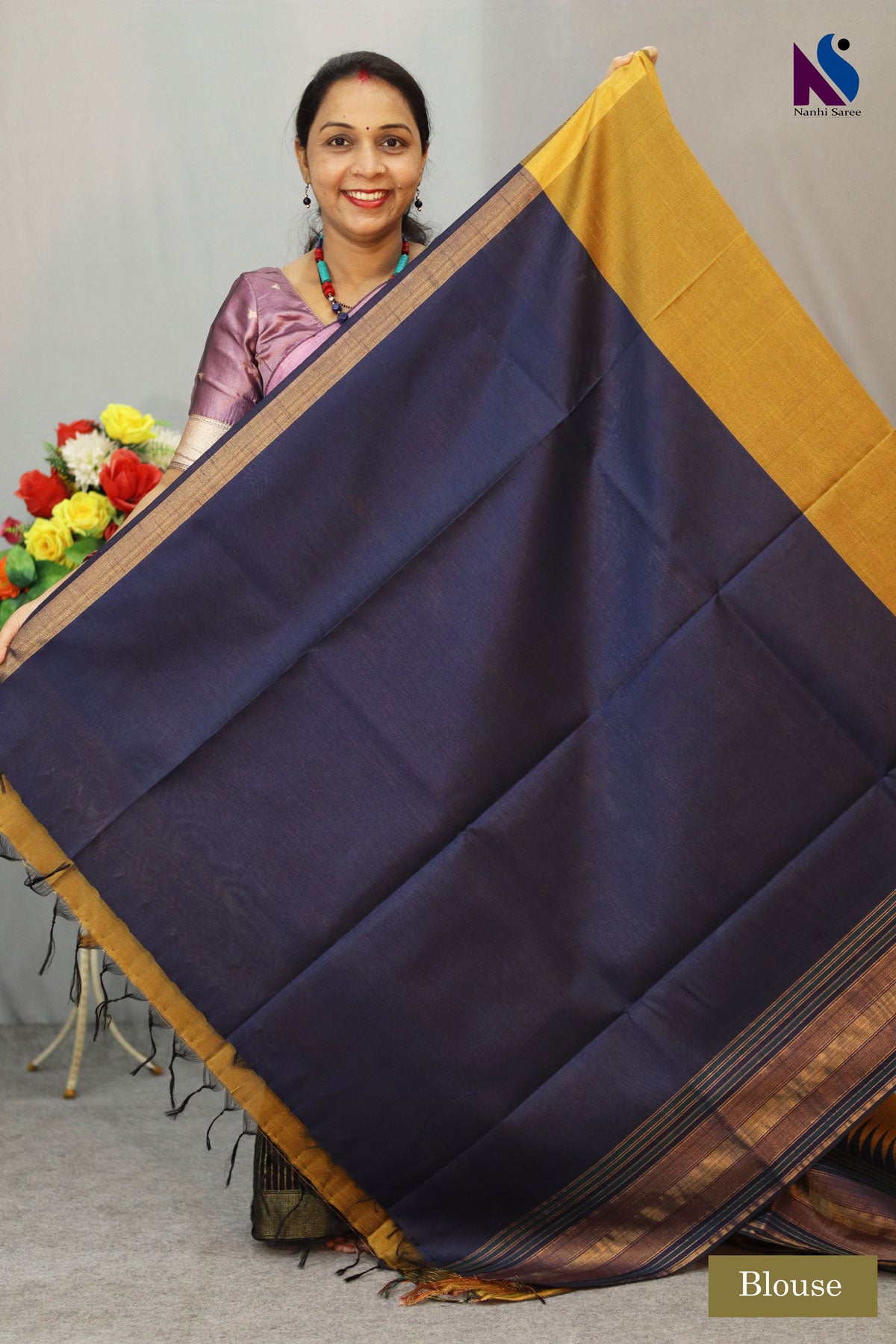 Earthy mustard tones woven in a graceful traditional handloom drape