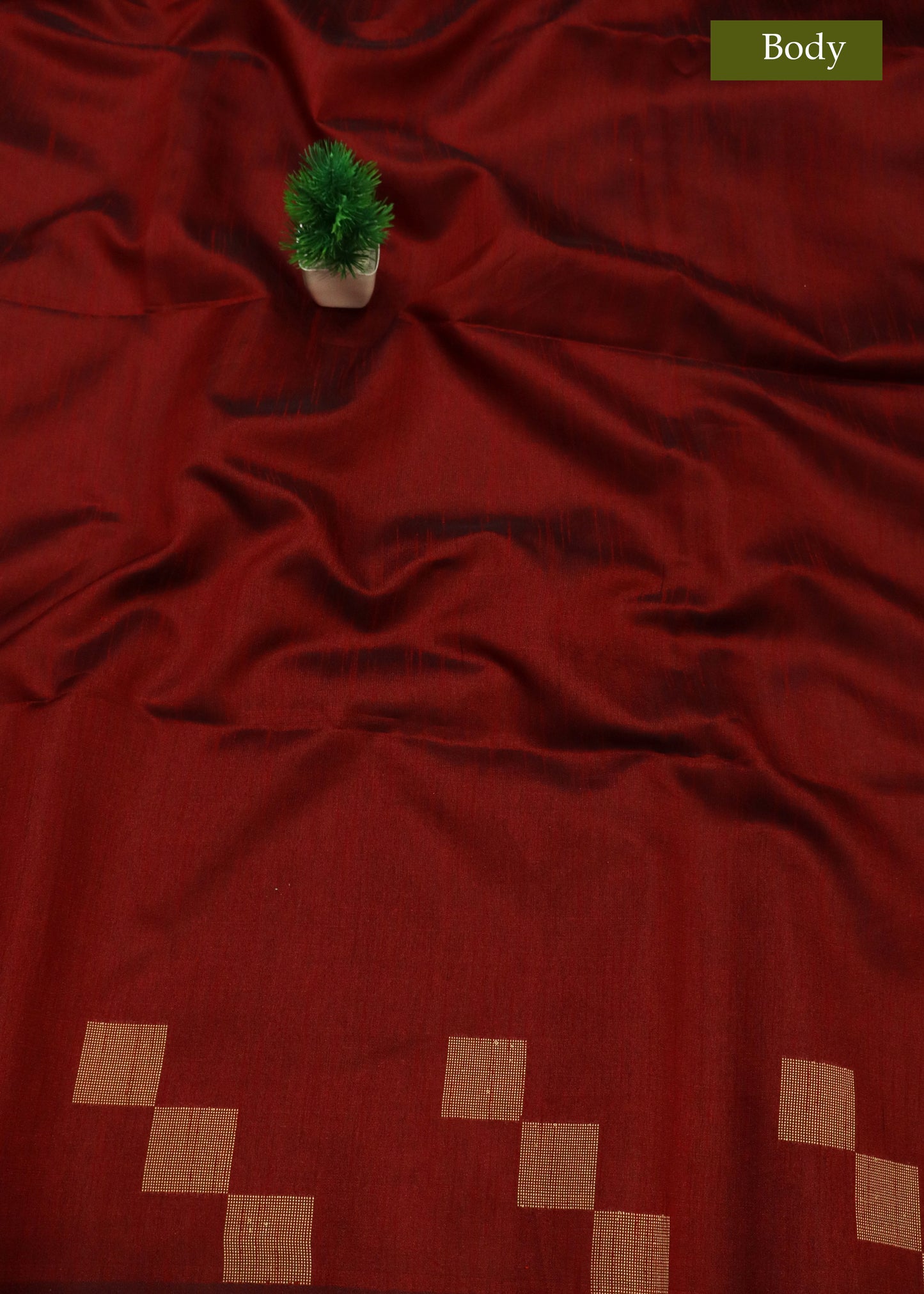 Deep wine red art silk saree with rich texture and traditional charm