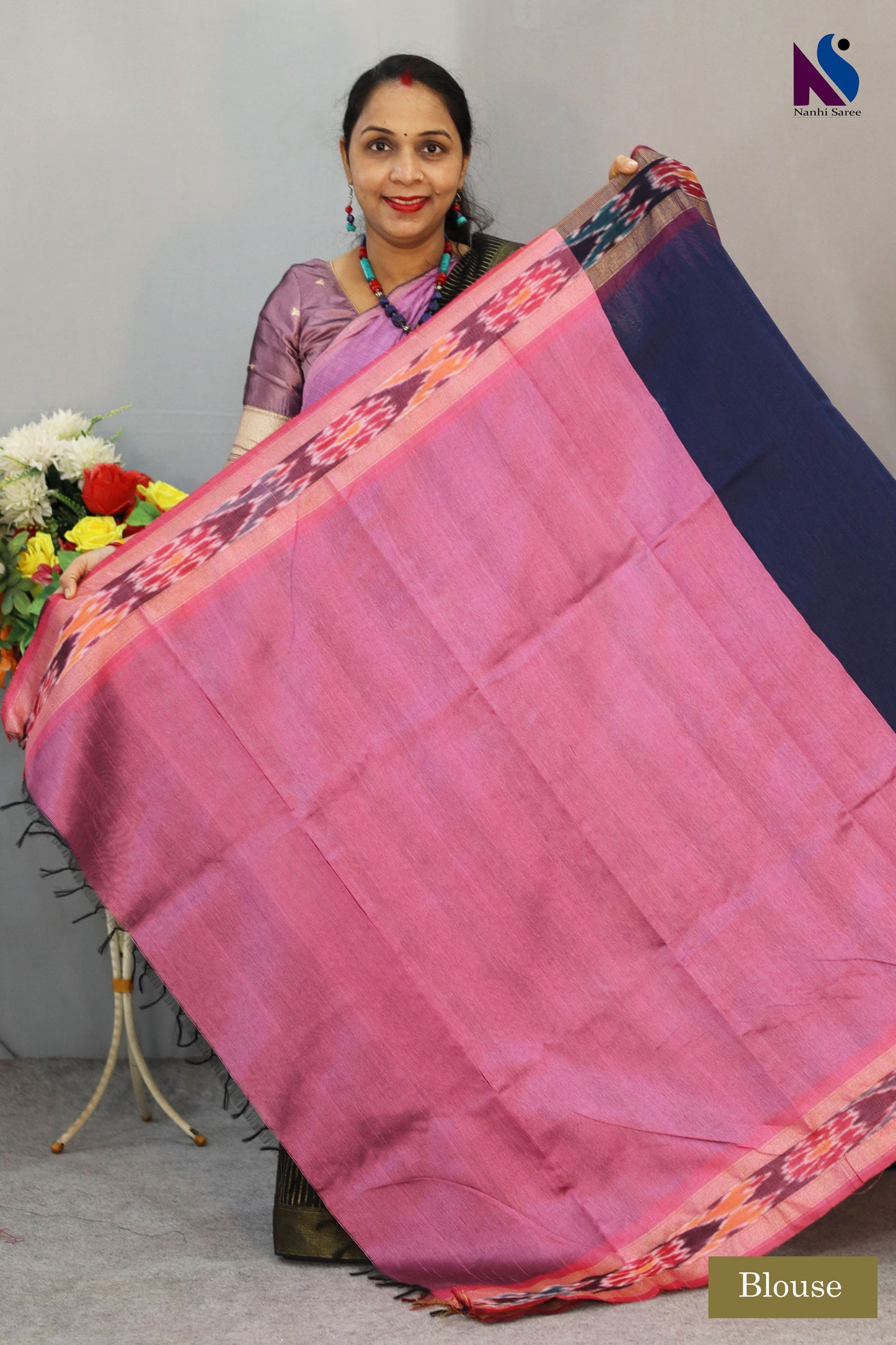Navy blue hues highlight the intricate Pochampally patterns in this handloom saree