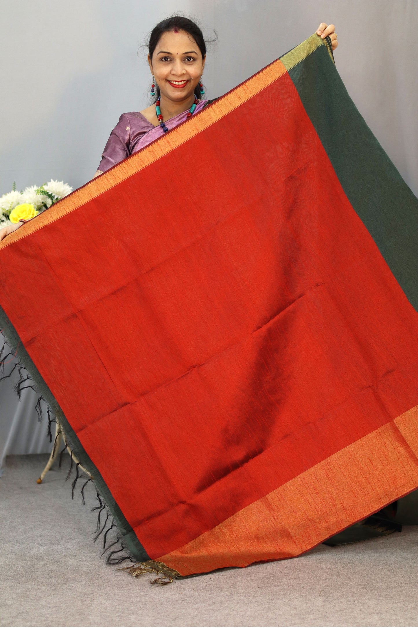 "Dark forest green art silk saree with elegant pallu design."