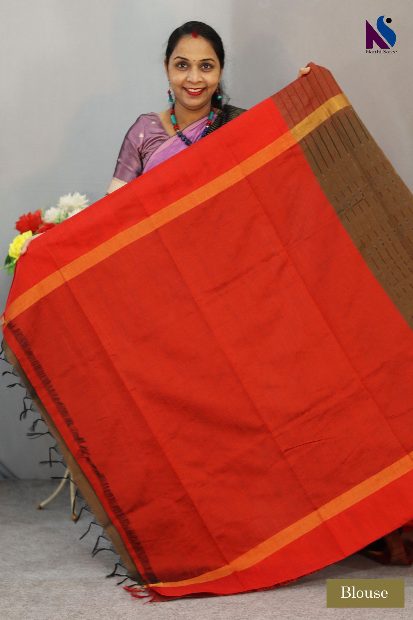 A striking mix of brown color and red color in Pochampally handloom saree