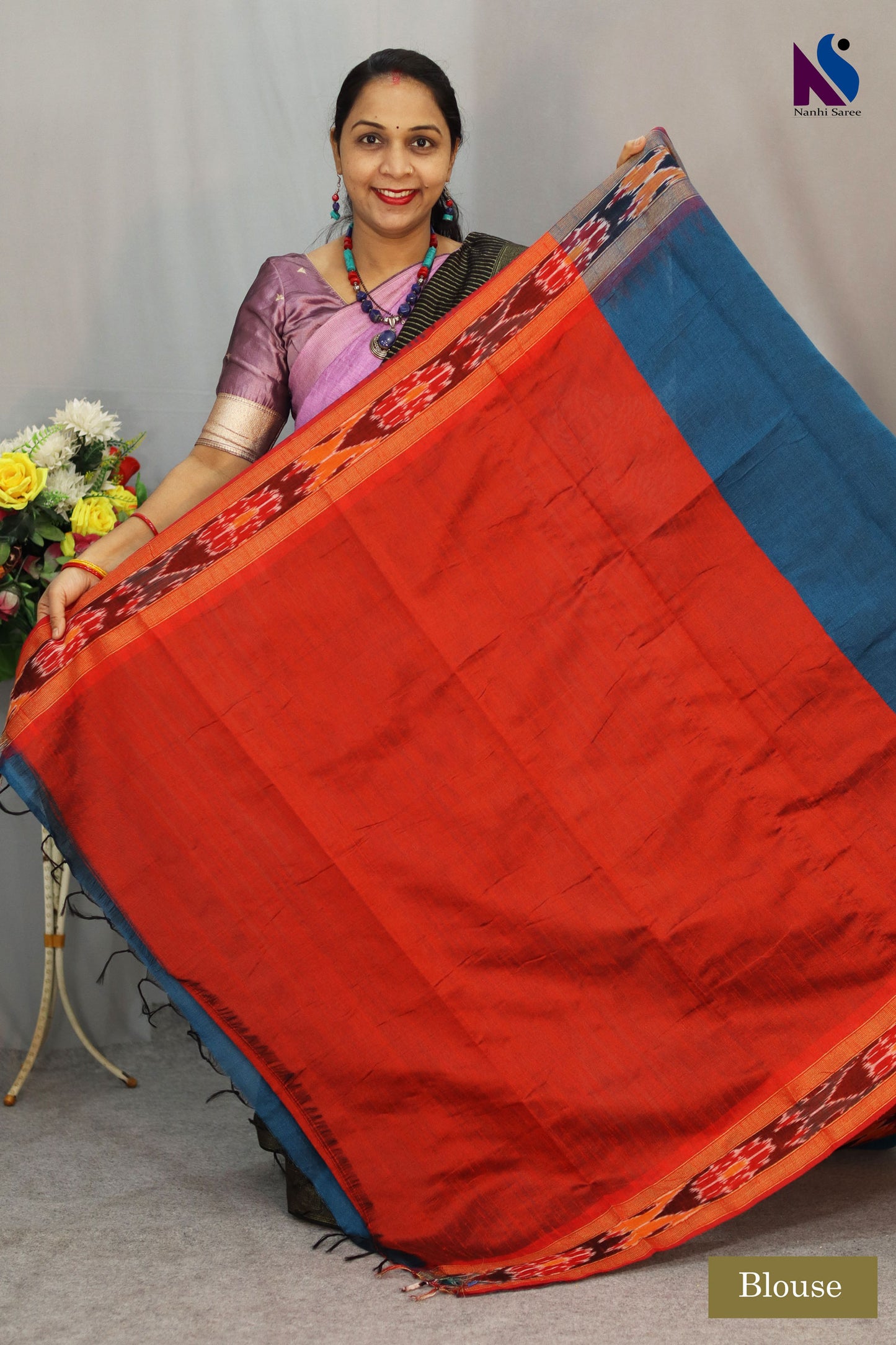 Rich royal blue tones enhance the elegance of this handloom saree