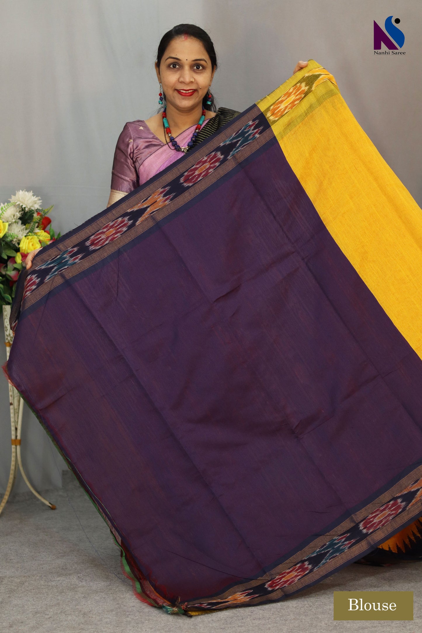 Vibrant rich yellow tones highlight the Pochampally handloom saree beautifully
