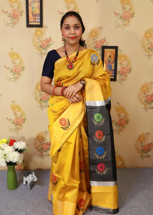 Radiant yellow art silk saree with graceful pallu design.
