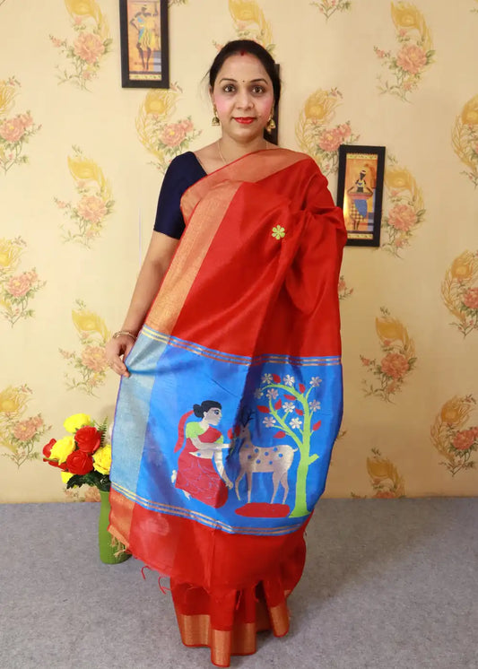 "Vibrant red art silk saree with beautifully crafted pallu."
