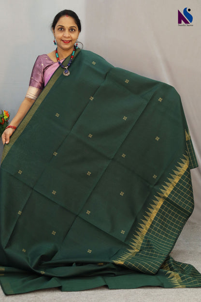 Deep earthy tones Dark green color saree and traditional weave in this handloom saree