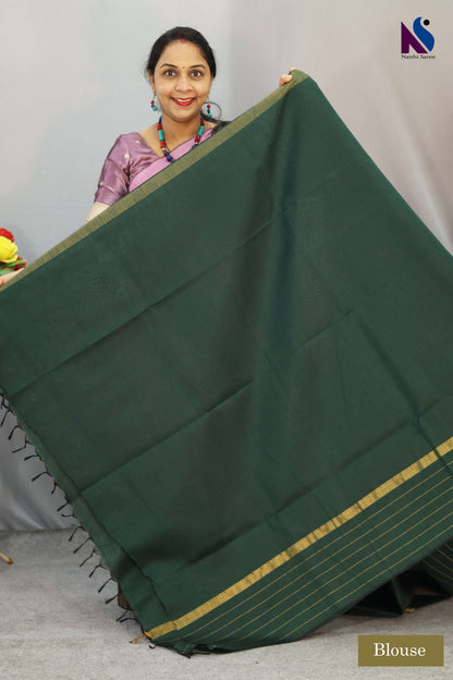 Deep earthy tones Dark green color saree and traditional weave in this handloom saree