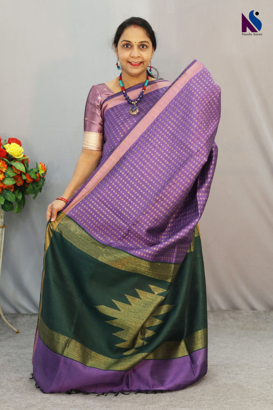 A graceful blend of colour and tradition in purple handloom saree