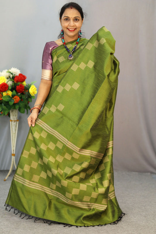 "Graceful mehendi green hand-woven saree, woven with elegance."