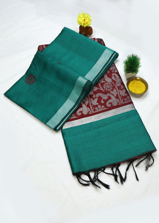 Handwoven teal art silk saree with bold red pallu craftsmanship