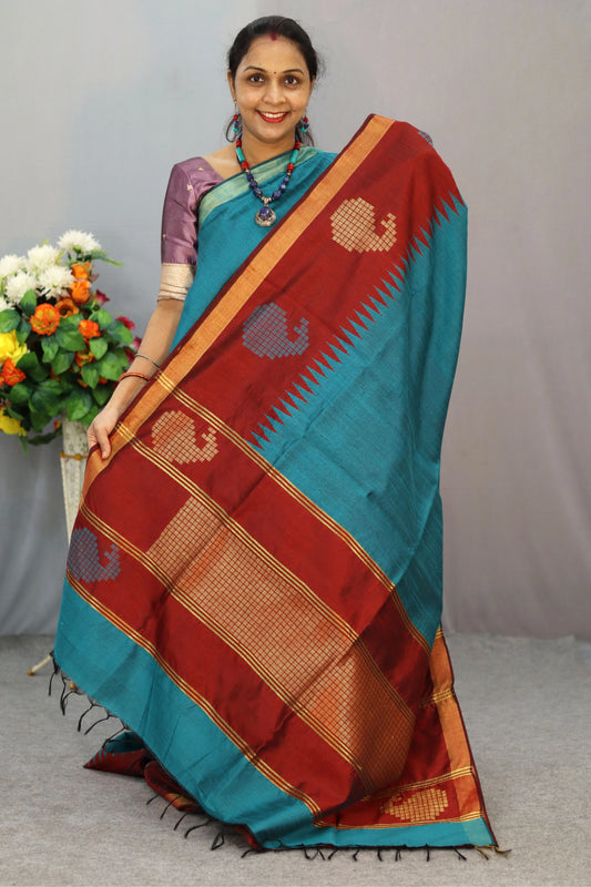 "Hand-woven saree, crafted with elegance in tropical teal colour."