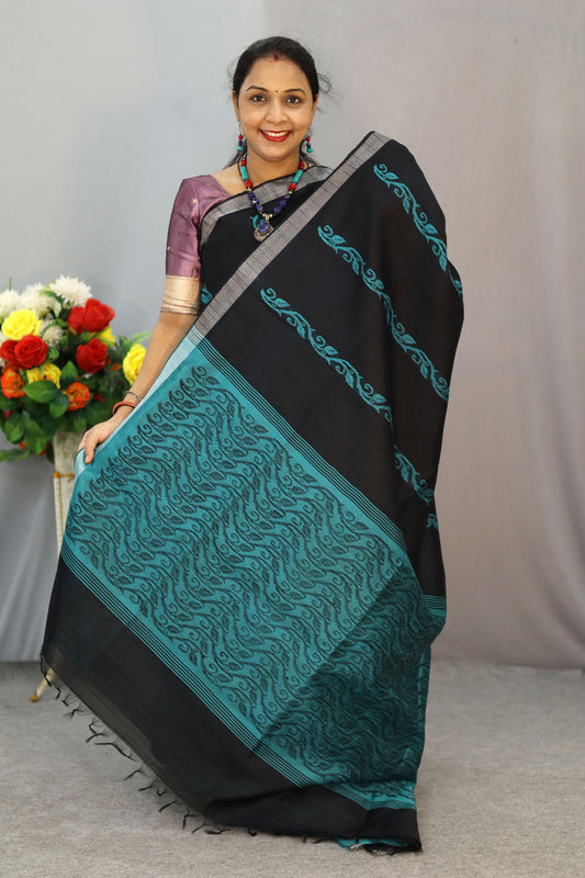 "Graceful handloom saree, exuding charm in classic black."