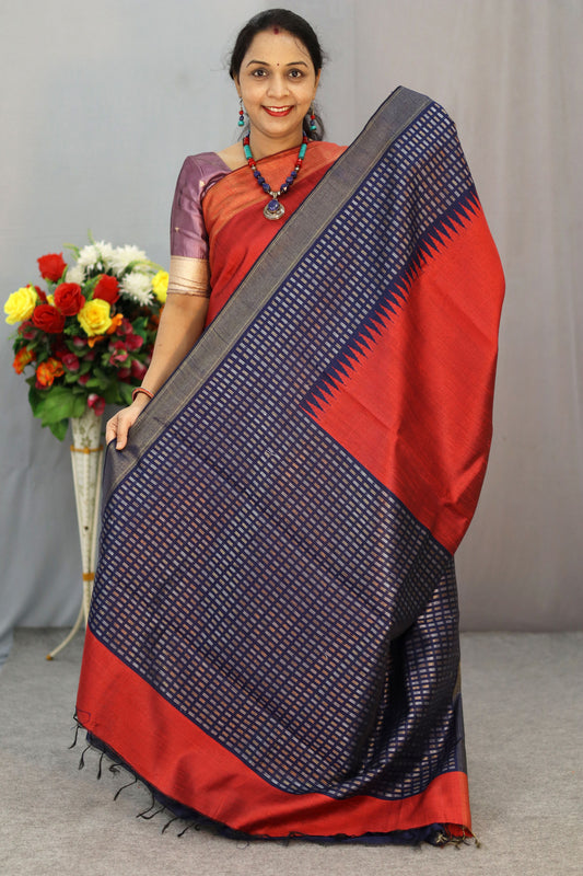 "Wine red art silk saree with navy blue square border design."