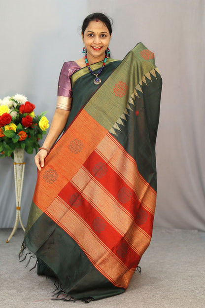 "Dark forest green art silk saree with elegant pallu design."