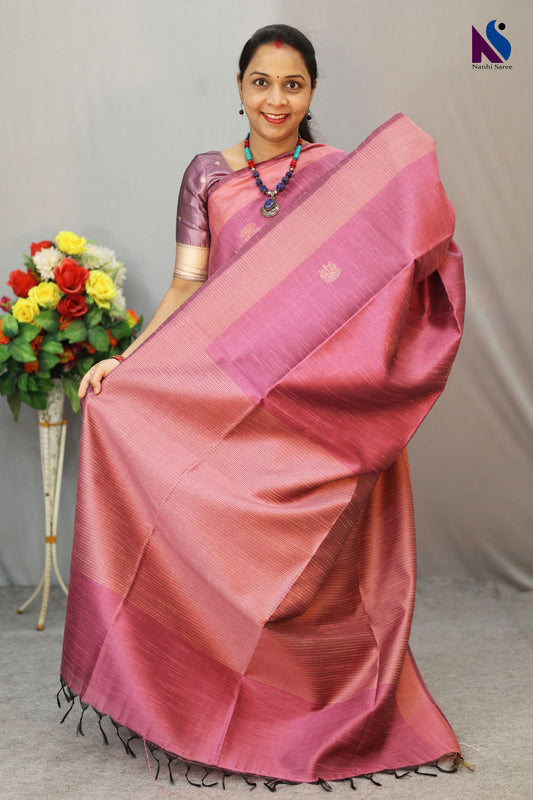 Delicate light pink tone enhanced with intricate handwoven detailing saree