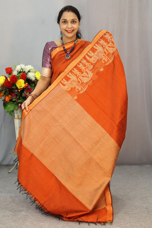 "Elegant rust orange art silk saree with timeless pallu design."