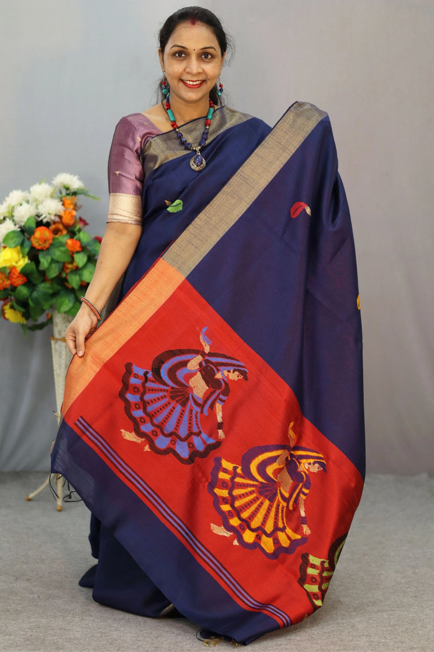 "Elegant navy blue hand-woven saree, crafted with intricate artistry."