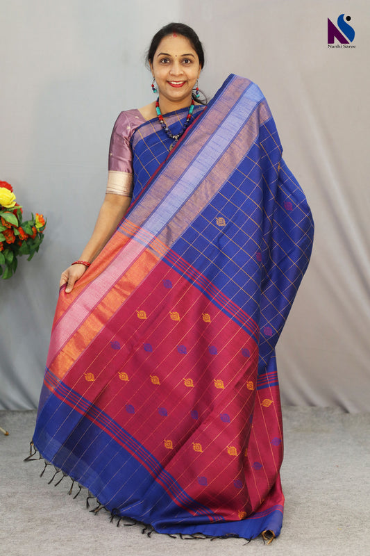 Fine buta detailing brings charm to this blue color handloom saree
