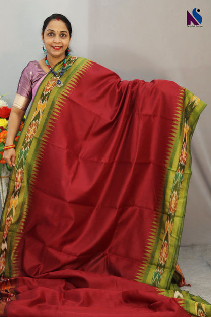 Traditional geometric patterns shine in this red Pochampally design handloom saree