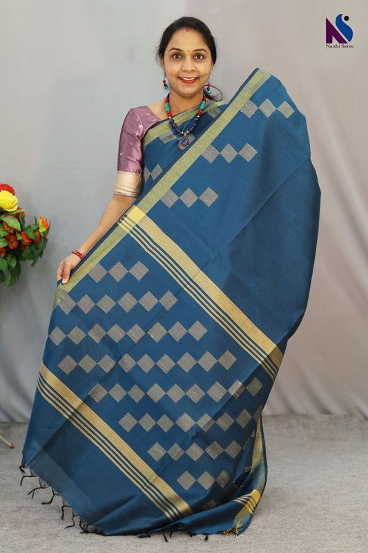 Beautiful detailing enhances the charm of this light blue handloom saree