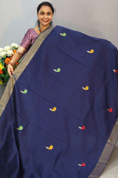"Elegant navy blue hand-woven saree, crafted with intricate artistry."