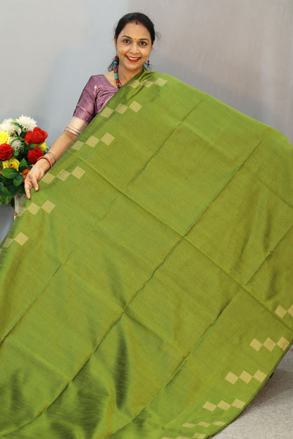 "Graceful mehendi green hand-woven saree, woven with elegance."