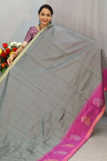 Handwoven gray art silk saree with soft yet striking pink pallu