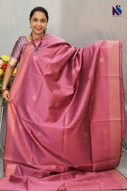 Delicate light pink tone enhanced with intricate handwoven detailing saree