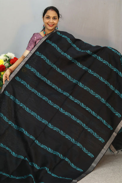 "Graceful handloom saree, exuding charm in classic black."