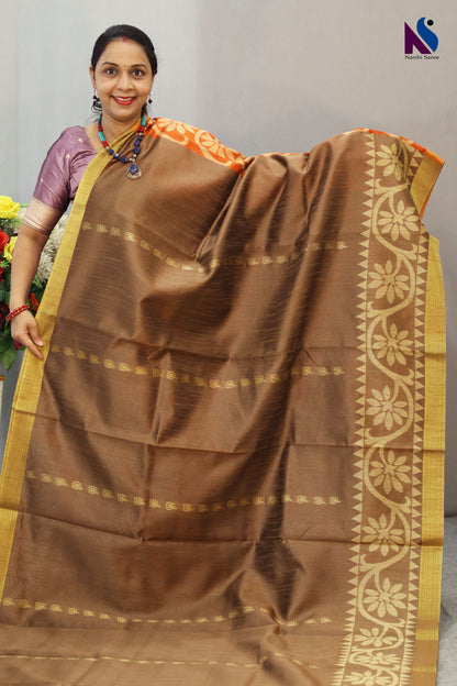 Subtle light brown tone enhanced with intricate handwoven detailing saree