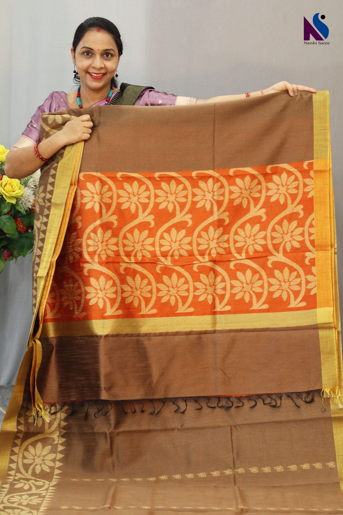 Subtle light brown tone enhanced with intricate handwoven detailing saree