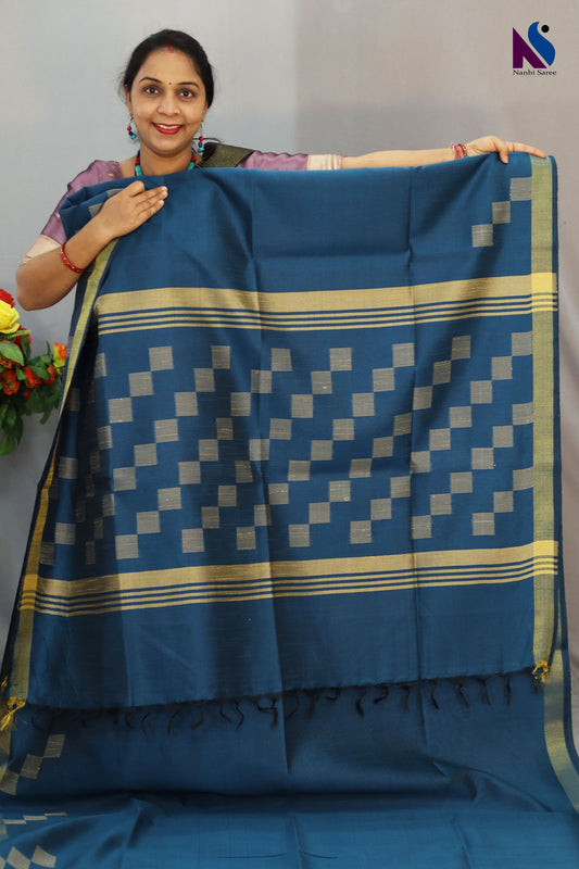Beautiful detailing enhances the charm of this light blue handloom saree