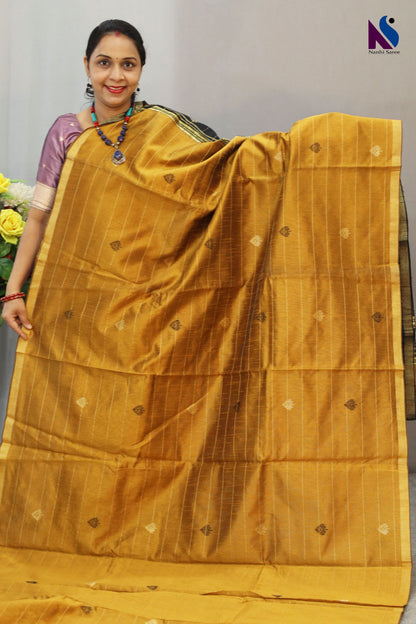 Royal fusion of golden and black crafted in premium handloom saree