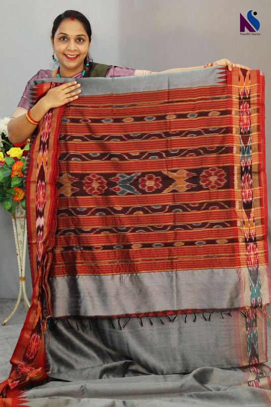 Traditional Pochampally design highlighted on this elegant grey handloom saree