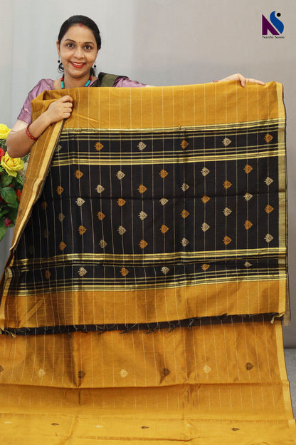 Royal fusion of golden and black crafted in premium handloom saree