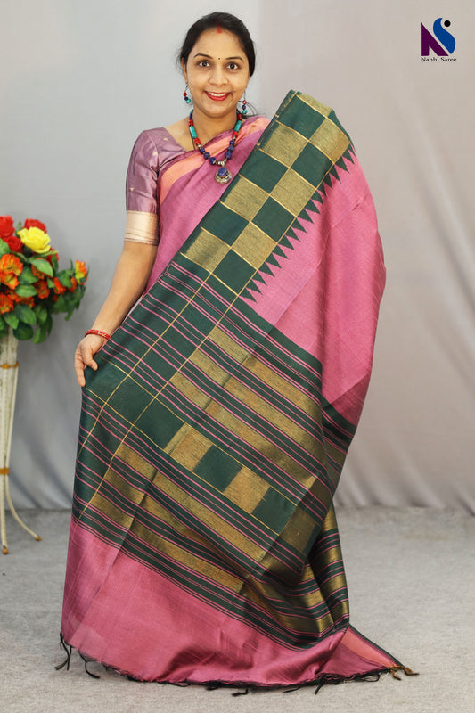 Soft light pink tones highlight the beautiful design of this handloom saree