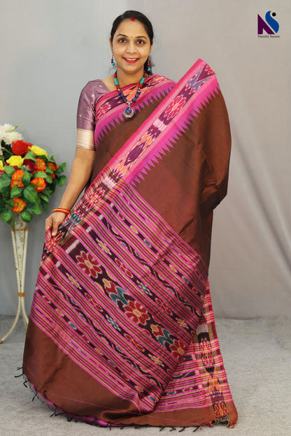 Warm brown hues blended with iconic Pochampally design handloom saree