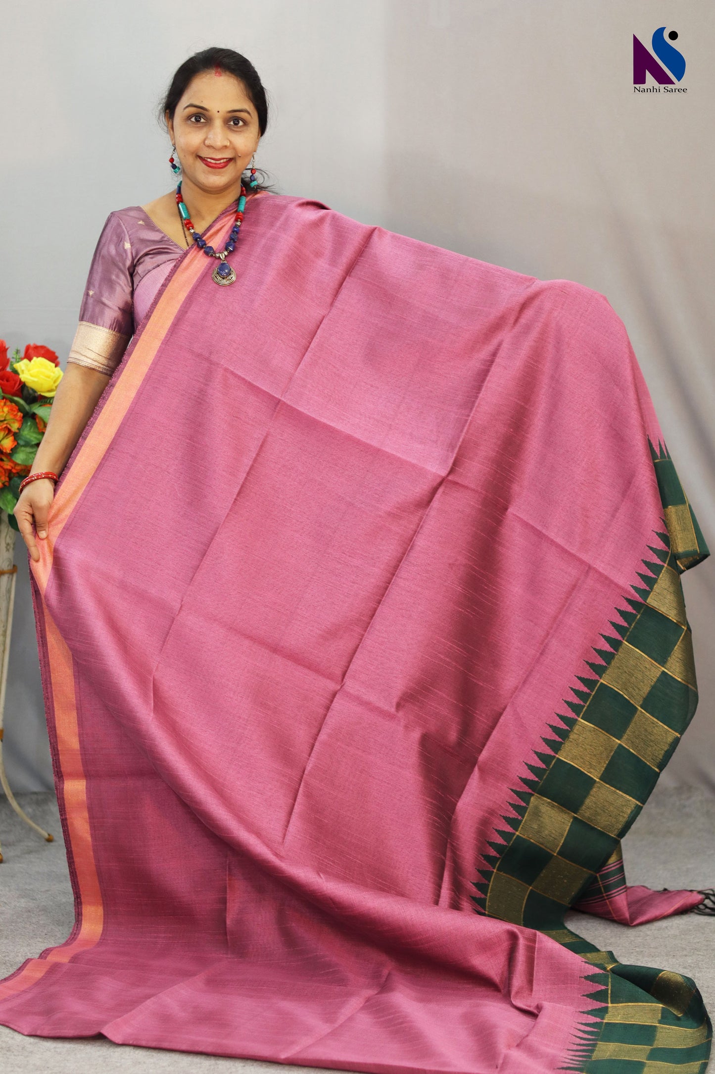Soft light pink tones highlight the beautiful design of this handloom saree