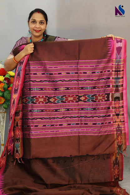 Warm brown hues blended with iconic Pochampally design handloom saree