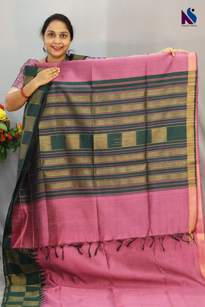Soft light pink tones highlight the beautiful design of this handloom saree