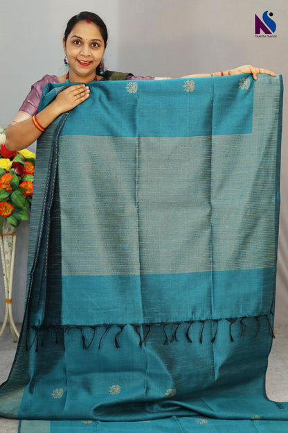 A handloom saree featuring buta work, contrast pallu and turquoise tones