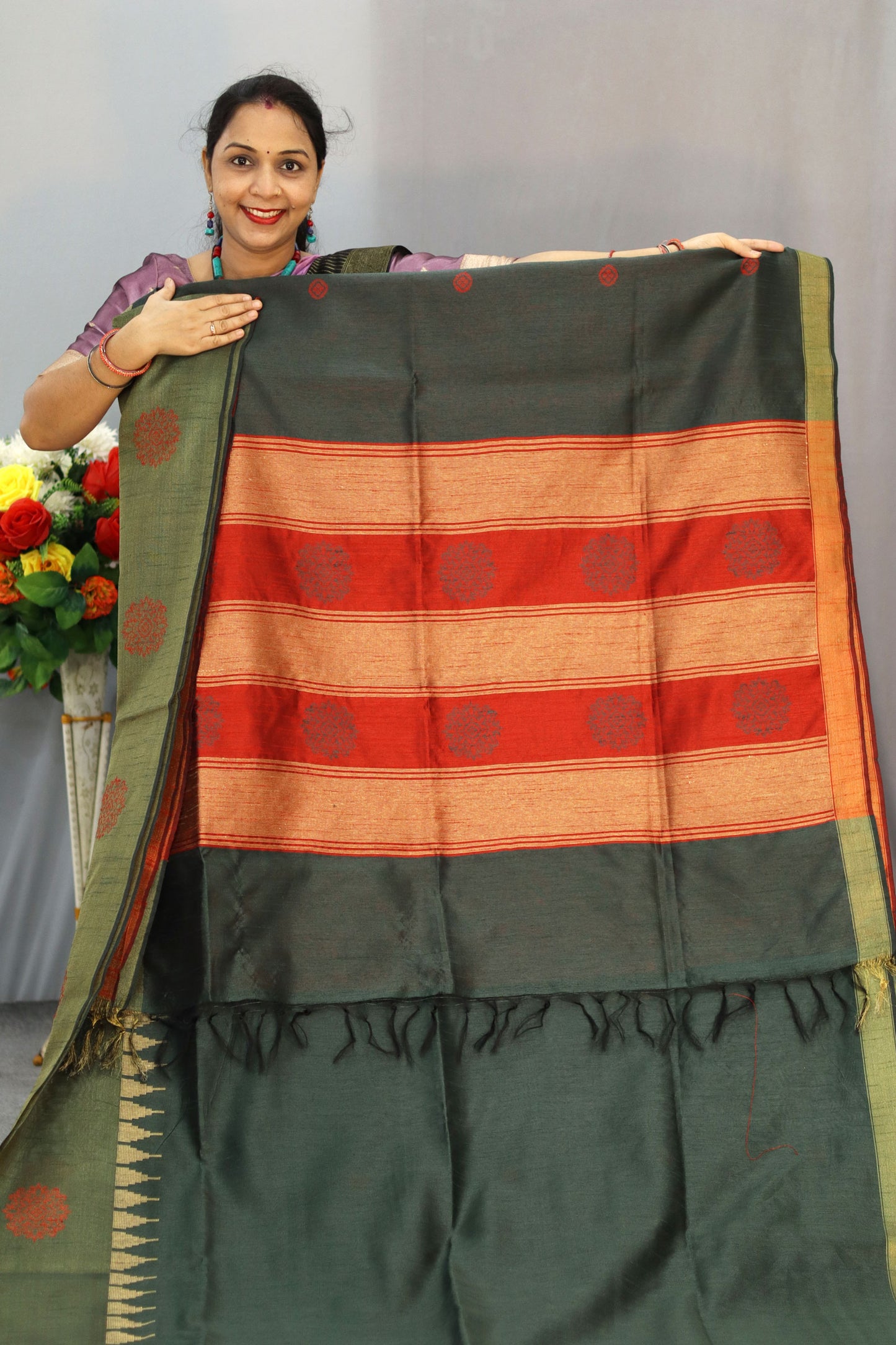 "Dark forest green art silk saree with elegant pallu design."